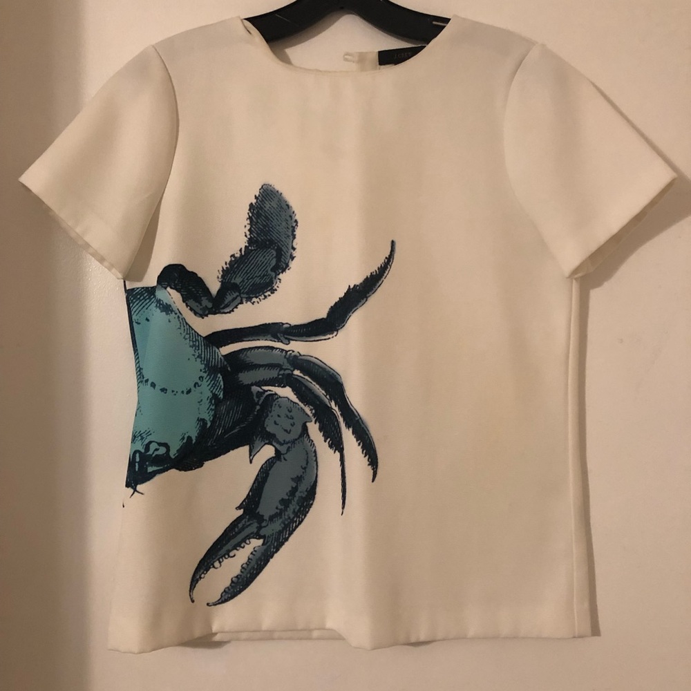 White j crew top with large crab image